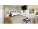 Bright bedroom with hardwood floors, a queen bed and large windows at 2618 Raven Dr, Sullivans Island, SC 29482