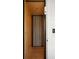 Modern hallway with a sliding door, recessed lighting, and minimalist design at 2618 Raven Dr, Sullivans Island, SC 29482