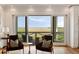 Living area with expansive windows showcasing a tranquil marsh view, seamlessly connecting indoor and outdoor spaces at 2618 Raven Dr, Sullivans Island, SC 29482