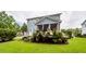 Beautiful backyard with lush greenery, screened porch and patio at 2632 Alderly Ln, Mount Pleasant, SC 29466