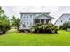 Beautiful backyard with lush greenery, screened porch and patio at 2632 Alderly Ln, Mount Pleasant, SC 29466