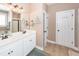 Bathroom featuring double sink vanity with white cabinetry and a framed mirror at 2632 Alderly Ln, Mount Pleasant, SC 29466