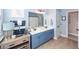 Bright bathroom featuring a double sink vanity with blue cabinets and modern lighting above a large mirror at 2632 Alderly Ln, Mount Pleasant, SC 29466