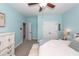 Bright bedroom with white furniture, open closet doors, and ceiling fan at 2632 Alderly Ln, Mount Pleasant, SC 29466