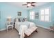 Well lit bedroom with large windows, bench, and bedside lamps at 2632 Alderly Ln, Mount Pleasant, SC 29466