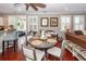 Bright breakfast nook with hardwood floors and windows offers additional seating adjacent to the kitchen at 2632 Alderly Ln, Mount Pleasant, SC 29466
