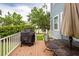 Outdoor deck with patio table, chairs, a grill, and a well-maintained yard and trees at 2632 Alderly Ln, Mount Pleasant, SC 29466