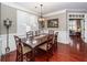 Sophisticated dining room with dark wood furniture, plantation shutters, and elegant chandelier at 2632 Alderly Ln, Mount Pleasant, SC 29466