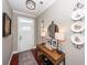 Tastefully decorated foyer with dark wood floors, stylish console table, and decorative wall accents at 2632 Alderly Ln, Mount Pleasant, SC 29466