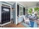 Inviting front porch with rocking chair, porch swing, and outdoor decor, perfect for relaxation at 2632 Alderly Ln, Mount Pleasant, SC 29466