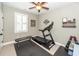 Home gym with treadmill, weight rack, rubber floor, and bench at 2632 Alderly Ln, Mount Pleasant, SC 29466