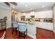Bright kitchen with island and seating features white cabinetry, hardwood floors, and modern appliances for gourmet cooking at 2632 Alderly Ln, Mount Pleasant, SC 29466