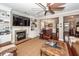 Comfortable living room boasts a fireplace, built-ins, ceiling fan and views of the dining room and entry at 2632 Alderly Ln, Mount Pleasant, SC 29466