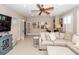 Relaxing living room space featuring a sofa, tv, and white french doors at 2632 Alderly Ln, Mount Pleasant, SC 29466