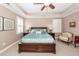 Cozy main bedroom featuring a tray ceiling, ceiling fan, and plush carpet at 2632 Alderly Ln, Mount Pleasant, SC 29466