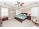 Serene main bedroom with tray ceiling, ceiling fan, and natural light at 2632 Alderly Ln, Mount Pleasant, SC 29466