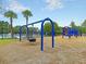 Community playground with swings, a tire swing, slides, and a pirate ship play structure at 2632 Alderly Ln, Mount Pleasant, SC 29466