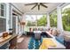 Comfortable screened porch with a ceiling fan, wicker sectional, patio table and outdoor views at 2632 Alderly Ln, Mount Pleasant, SC 29466