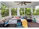 Relaxing screened-in porch with comfortable seating, a ceiling fan, curtains, and outdoor views at 2632 Alderly Ln, Mount Pleasant, SC 29466