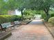 Tree-lined brick walking path with benches at Rivertowne on the Wando at 2632 Alderly Ln, Mount Pleasant, SC 29466