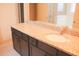 Bathroom vanity featuring granite countertops, dark cabinets, and a ceramic sink at 303 Citation Way, Moncks Corner, SC 29461