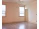 Bright, airy bedroom features hardwood floors, neutral paint, and abundant natural light from large windows at 303 Citation Way, Moncks Corner, SC 29461
