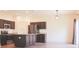 Modern kitchen features dark cabinets, stainless steel appliances, a kitchen island, and ample counter space at 303 Citation Way, Moncks Corner, SC 29461