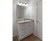 Bathroom features a modern vanity with marble counters, a large mirror, and modern lighting at 31 W 9Th St, Folly Beach, SC 29439