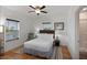 Bright bedroom with hardwood floors, a ceiling fan, and views from two large windows at 31 W 9Th St, Folly Beach, SC 29439