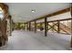 Open carport with stairs leading to an upper level and wooden beams for structural support at 31 W 9Th St, Folly Beach, SC 29439