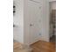Hallway view of a modern bathroom with a seashell shower curtain at 31 W 9Th St, Folly Beach, SC 29439