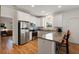 Kitchen featuring stainless steel appliances, white cabinetry, and bar seating, perfect for modern living at 31 W 9Th St, Folly Beach, SC 29439