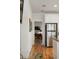 Hallway view near the kitchen leading to a room with television at 31 W 9Th St, Folly Beach, SC 29439