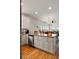 Open kitchen featuring a large island with counter seating and stainless steel dishwasher at 31 W 9Th St, Folly Beach, SC 29439