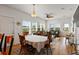 Open-concept layout showcasing the dining area that transitions into the cozy living room filled with natural light at 31 W 9Th St, Folly Beach, SC 29439