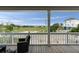 Covered porch seating area with lovely views of a waterway at 31 W 9Th St, Folly Beach, SC 29439