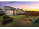Inviting backyard with a fire pit, screened-in porch, and a well-maintained fence at 315 Black Birch Dr, Summerville, SC 29486