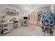 A bedroom features a computer desk, mirror, and white cabinet at 315 Black Birch Dr, Summerville, SC 29486