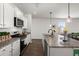 Modern kitchen with stainless steel appliances, granite countertops, and a kitchen island at 315 Black Birch Dr, Summerville, SC 29486