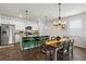 Open-concept kitchen and dining area with a kitchen island and modern lighting at 315 Black Birch Dr, Summerville, SC 29486
