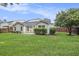 Well-maintained backyard featuring a lush green lawn, privacy fence and solar panels at 341 Drayton Place Drive Dr, Moncks Corner, SC 29461