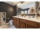 Stylish bathroom with double vanity, framed mirror, and wood cabinets for ample storage at 341 Drayton Place Drive Dr, Moncks Corner, SC 29461