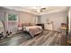 Cozy bedroom with a ceiling fan, neutral color palette, and plenty of natural light at 341 Drayton Place Drive Dr, Moncks Corner, SC 29461