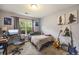 Comfortable bedroom with a large window, computer desk, and guitar display at 341 Drayton Place Drive Dr, Moncks Corner, SC 29461