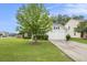 Charming home with a well-manicured lawn and a two-car garage at 341 Drayton Place Drive Dr, Moncks Corner, SC 29461