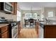Bright kitchen featuring stainless steel appliances, granite countertops, and dining area with large windows at 341 Drayton Place Drive Dr, Moncks Corner, SC 29461