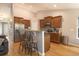 Open kitchen with wooden cabinets, stainless steel appliances, and a breakfast bar with seating at 341 Drayton Place Drive Dr, Moncks Corner, SC 29461