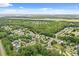 Lovely aerial view of the neighborhood with many trees and beautiful ponds at 3486 Ashwycke St, Mount Pleasant, SC 29466