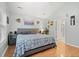 A well-lit bedroom featuring a comfortable bed, coordinated decor, and an ensuite bathroom at 3486 Ashwycke St, Mount Pleasant, SC 29466