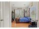 A vibrant bedroom with a large window, wooden floors, and bright Pokemon decor at 3486 Ashwycke St, Mount Pleasant, SC 29466